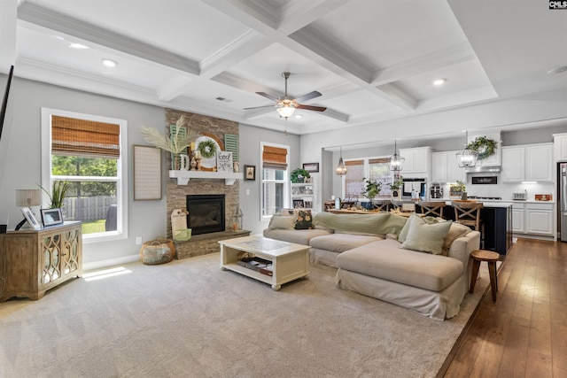 214 Chapin Brook Ct, Chapin, SC 29036 - living area featuring beamed ceiling, coffered ceiling, a stone fireplace, ceiling fan, and recessed lighting