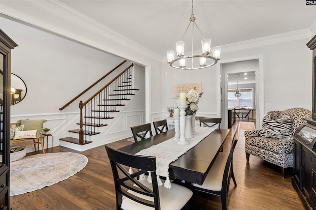 214 Chapin Brook Ct, Chapin, SC 29036 - dining area featuring a chandelier, stairway, ornamental molding, dark wood-style flooring, and a wainscoted wall