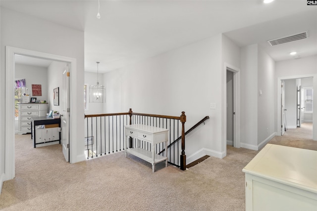 214 Chapin Brook Ct, Chapin, SC 29036 - hallway with an upstairs landing, light colored carpet, recessed lighting, and a chandelier