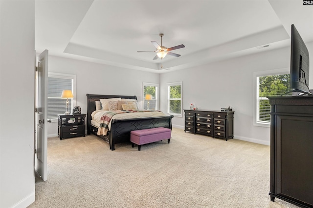 214 Chapin Brook Ct, Chapin, SC 29036 - bedroom with a tray ceiling, light carpet, multiple windows, and a ceiling fan