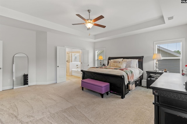 214 Chapin Brook Ct, Chapin, SC 29036 - bedroom featuring a raised ceiling, light carpet, ensuite bath, and ceiling fan