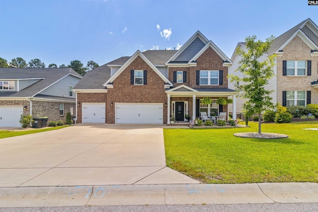 214 Chapin Brook Ct, Chapin, SC 29036 - craftsman-style house featuring brick siding, driveway, a porch, a front lawn, and a garage