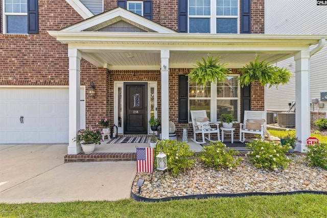 214 Chapin Brook Ct, Chapin, SC 29036 - property entrance featuring a porch, brick siding, and driveway