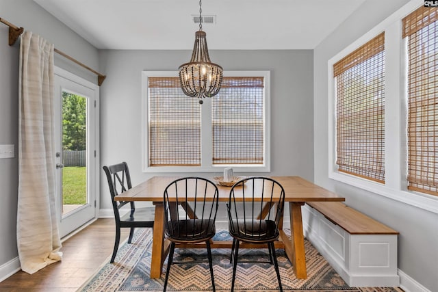 214 Chapin Brook Ct, Chapin, SC 29036 - dining room with a chandelier and wood finished floors