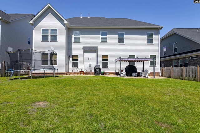 214 Chapin Brook Ct, Chapin, SC 29036 - back of house with a trampoline, a fenced backyard, a patio area, and a pergola