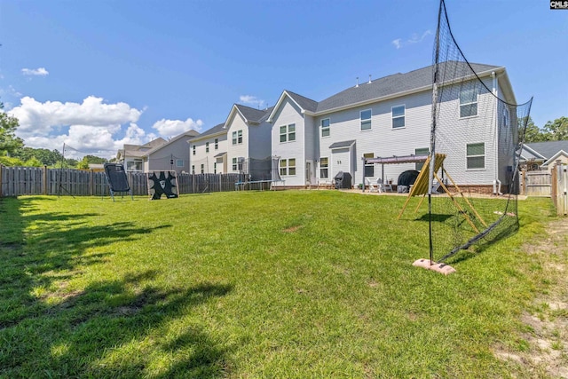 214 Chapin Brook Ct, Chapin, SC 29036 - rear view of house with a trampoline, a fenced backyard, and a residential view