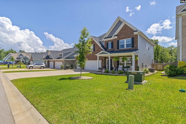 214 Chapin Brook Ct, Chapin, SC 29036 - view of front facade with driveway, brick siding, covered porch, and a residential view