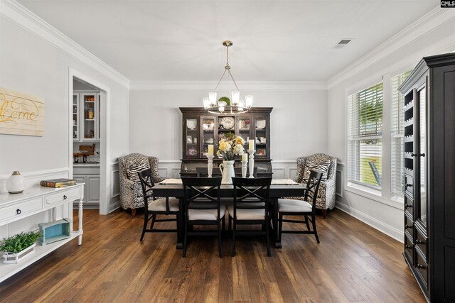214 Chapin Brook Ct, Chapin, SC 29036 - dining area with a chandelier, ornamental molding, dark wood-style flooring, wainscoting, and a decorative wall