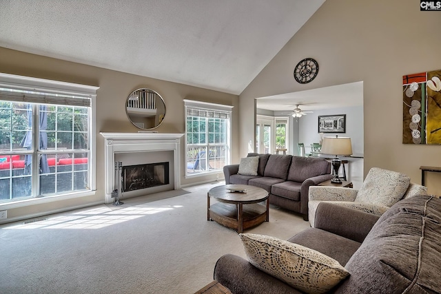 4 Beckworth Ct, Irmo, SC 29063 - living area with carpet floors, high vaulted ceiling, healthy amount of natural light, a fireplace with flush hearth, and a ceiling fan