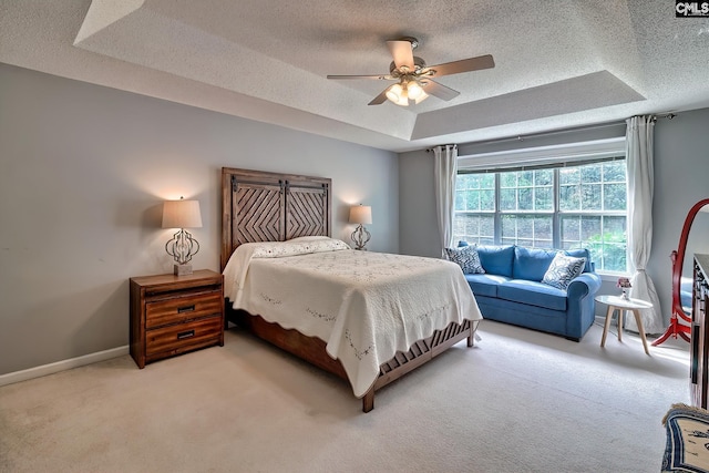 4 Beckworth Ct, Irmo, SC 29063 - carpeted bedroom featuring a tray ceiling, a textured ceiling, and a ceiling fan