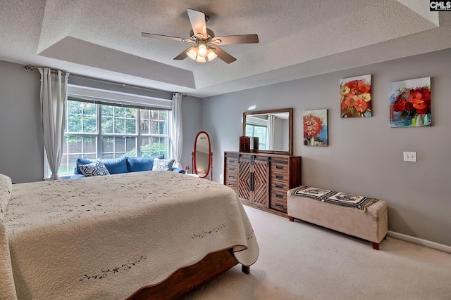 4 Beckworth Ct, Irmo, SC 29063 - bedroom featuring a tray ceiling, carpet flooring, a textured ceiling, and a ceiling fan
