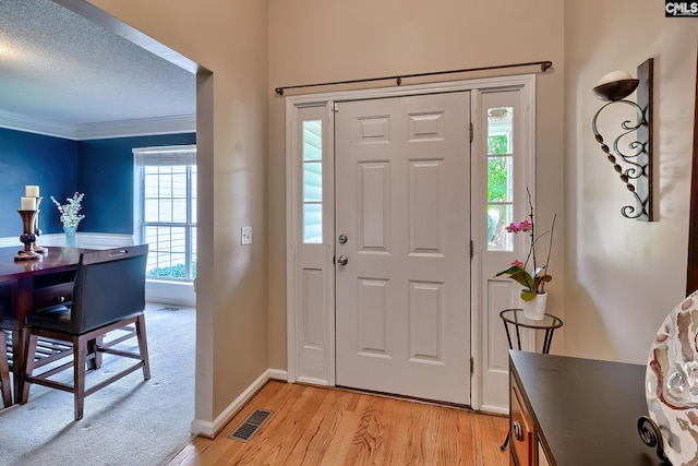 4 Beckworth Ct, Irmo, SC 29063 - entrance foyer with light wood-type flooring, crown molding, and a textured ceiling