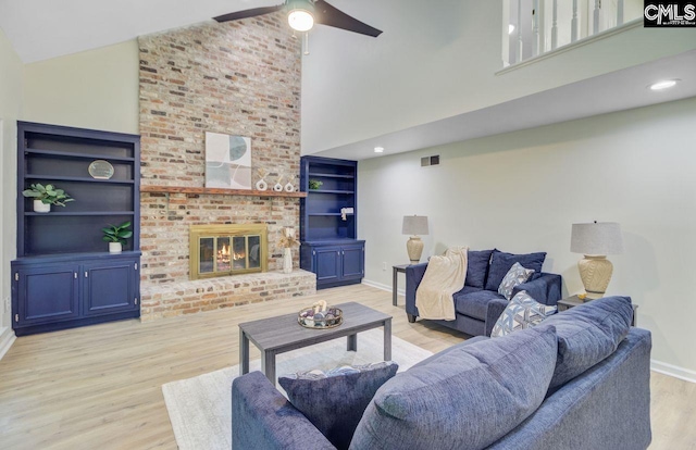 303 High Grove Rd, Summerville, SC 29485 - living room featuring high vaulted ceiling, light wood-type flooring, a fireplace, and ceiling fan