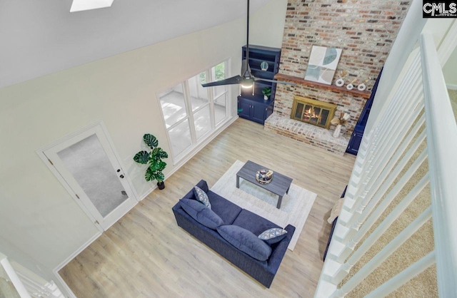 303 High Grove Rd, Summerville, SC 29485 - living area with wood finished floors, high vaulted ceiling, and a fireplace