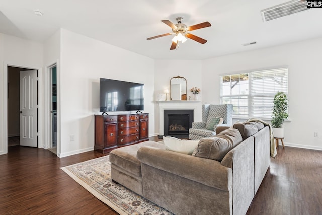 512 Eagles Rest Dr, Chapin, SC 29036 - living area with dark wood-type flooring, a glass covered fireplace, and a ceiling fan