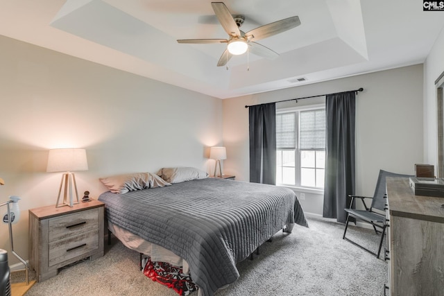 938 Farnsworth Dr, Hopkins, SC 29061 - bedroom with a tray ceiling, light colored carpet, and a ceiling fan