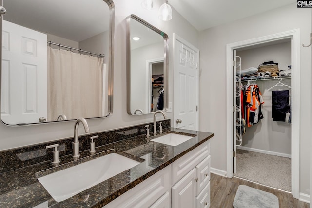 938 Farnsworth Dr, Hopkins, SC 29061 - full bath featuring double vanity, wood finished floors, and a walk in closet