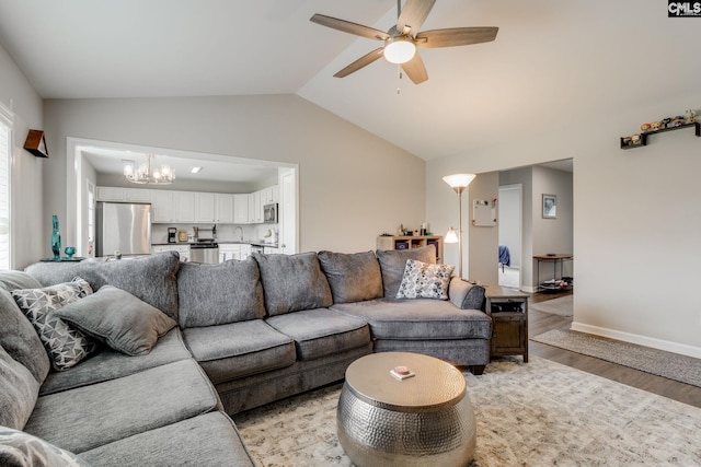 938 Farnsworth Dr, Hopkins, SC 29061 - living room with a ceiling fan, a chandelier, light wood-style floors, and lofted ceiling