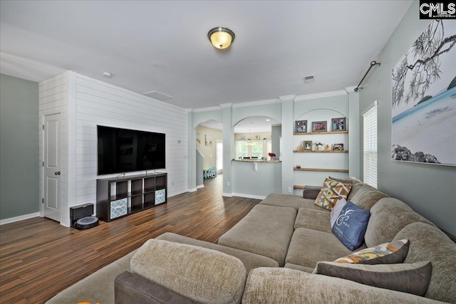 620 Blue Ledge Cir, Lexington, SC 29072 - living room with arched walkways, dark wood-style floors, and crown molding