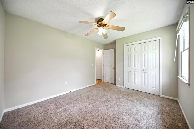 224 Ashton Cir, Lexington, SC 29073 - unfurnished bedroom featuring carpet, a closet, a textured ceiling, and ceiling fan