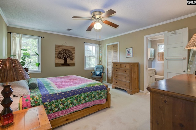 2817 Duncan St, Columbia, SC 29205 - bedroom featuring light colored carpet, a closet, ensuite bath, crown molding, and ceiling fan