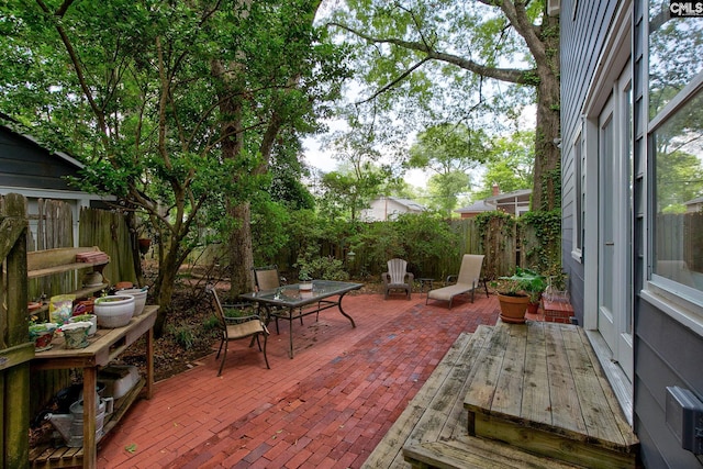 2817 Duncan St, Columbia, SC 29205 - fenced backyard with outdoor dining area, a patio, and a deck