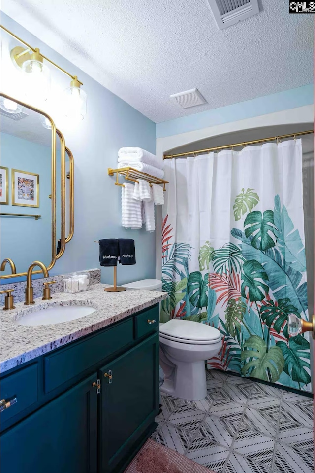 2009 Greene St Unit 403, Columbia, SC 29205 - bathroom with vanity, a textured ceiling, and curtained shower