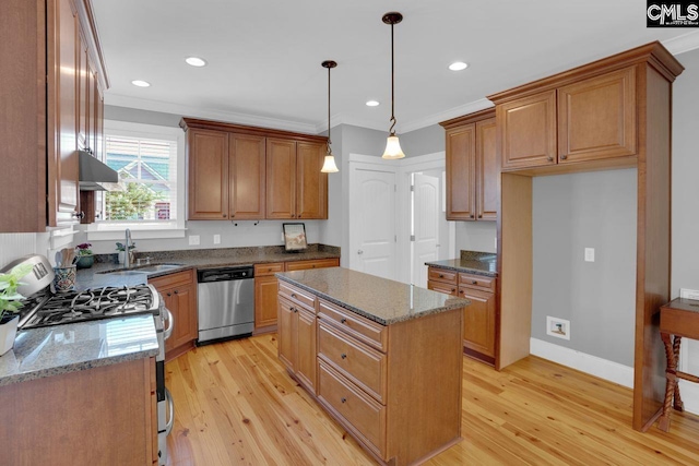 100 Julia Ct, Lexington, SC 29072 - kitchen with appliances with stainless steel finishes, under cabinet range hood, a center island, light wood-style flooring, and dark stone countertops
