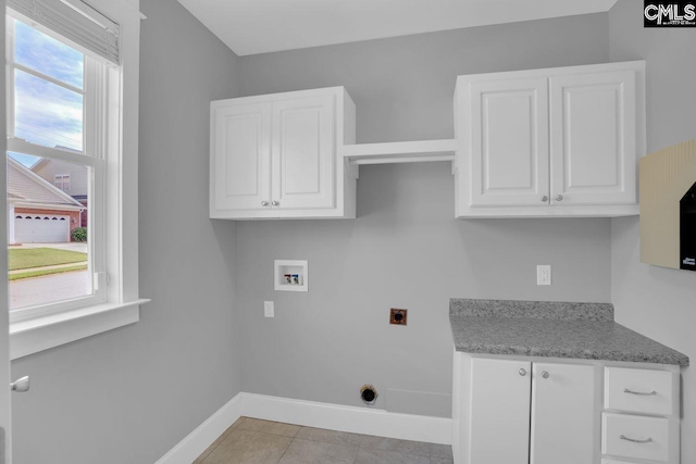 100 Julia Ct, Lexington, SC 29072 - laundry area featuring electric dryer hookup, cabinet space, washer hookup, and light tile patterned floors