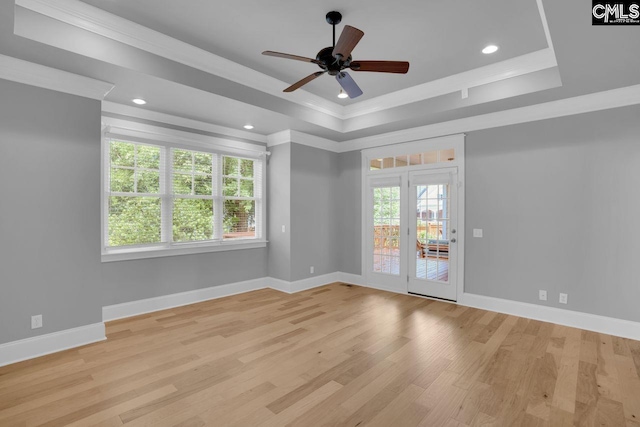 100 Julia Ct, Lexington, SC 29072 - empty room featuring crown molding, healthy amount of natural light, a raised ceiling, light wood-type flooring, and ceiling fan