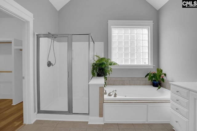 100 Julia Ct, Lexington, SC 29072 - bathroom featuring lofted ceiling, a stall shower, a garden tub, a walk in closet, and vanity