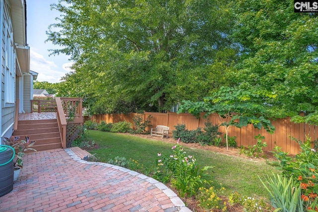 100 Julia Ct, Lexington, SC 29072 - fenced backyard with a patio area and a wooden deck