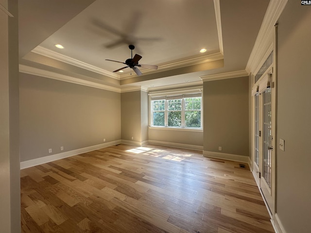 100 Julia Ct, Lexington, SC 29072 - spare room featuring a tray ceiling, ornamental molding, light wood finished floors, ceiling fan, and recessed lighting