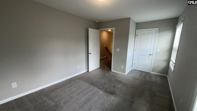 1020 Winter Way, Lexington, SC 29073 - unfurnished bedroom with dark carpet and baseboards