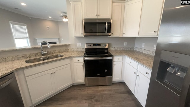 1020 Winter Way, Lexington, SC 29073 - kitchen with stainless steel appliances, recessed lighting, a ceiling fan, dark wood finished floors, and white cabinetry