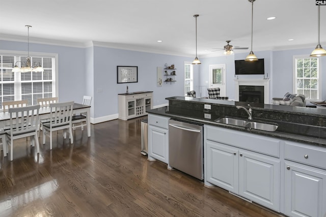 3722 Heyward St, Columbia, SC 29205 - kitchen with dishwasher, a fireplace, ceiling fan, ornamental molding, and a chandelier