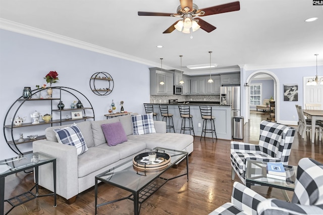 3722 Heyward St, Columbia, SC 29205 - living room featuring crown molding, a ceiling fan, recessed lighting, arched walkways, and dark wood-type flooring