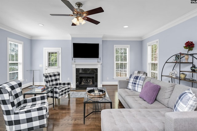 3722 Heyward St, Columbia, SC 29205 - living area featuring crown molding, healthy amount of natural light, a tiled fireplace, wood finished floors, and recessed lighting