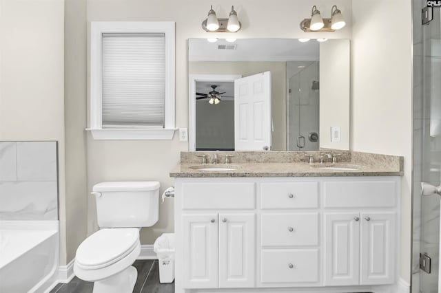 3722 Heyward St, Columbia, SC 29205 - full bath with double vanity, ceiling fan, a shower stall, and a garden tub
