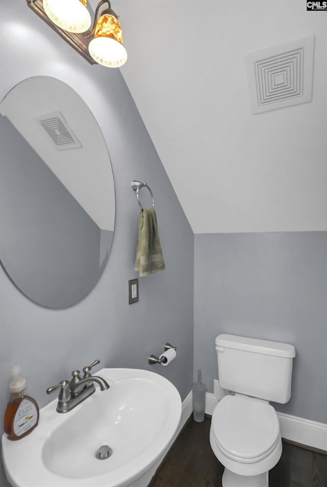 3722 Heyward St, Columbia, SC 29205 - bathroom featuring wood finished floors and lofted ceiling