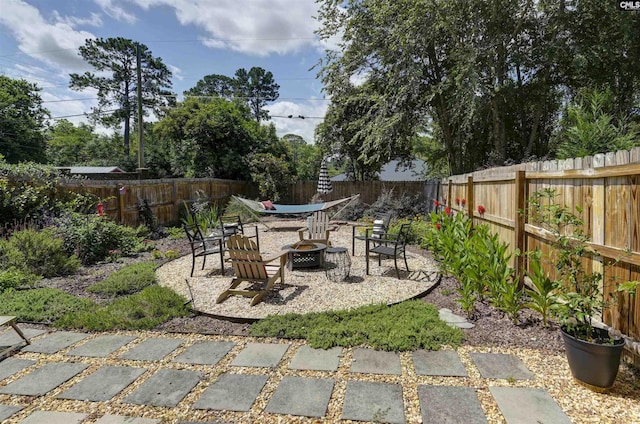 3722 Heyward St, Columbia, SC 29205 - fenced backyard with a fire pit and a patio area