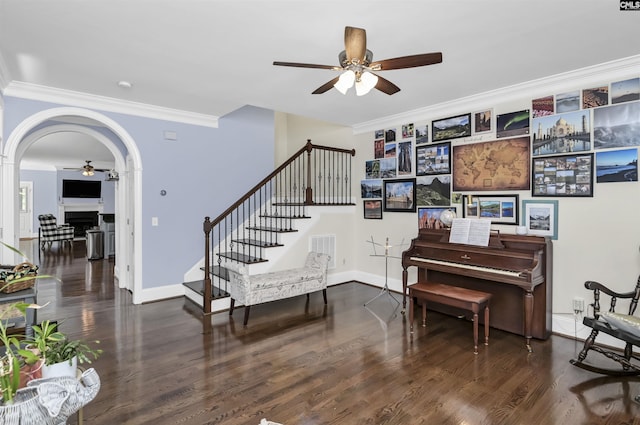 3722 Heyward St, Columbia, SC 29205 - living area with a ceiling fan, ornamental molding, stairway, arched walkways, and wood finished floors