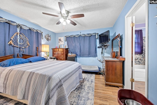 3204 Windmill Rd, Leesville, SC 29070 - bedroom with wood finished floors, a textured ceiling, and a ceiling fan