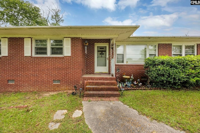3204 Windmill Rd, Leesville, SC 29070 - view of front facade with brick siding, a front lawn, and crawl space