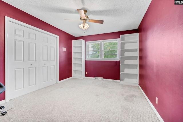 3204 Windmill Rd, Leesville, SC 29070 - unfurnished bedroom with a closet, carpet floors, a textured ceiling, and ceiling fan