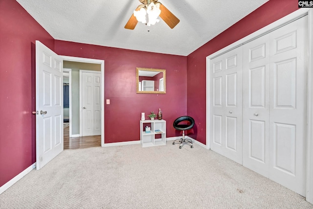 3204 Windmill Rd, Leesville, SC 29070 - unfurnished bedroom with carpet flooring, a closet, a textured ceiling, and a ceiling fan