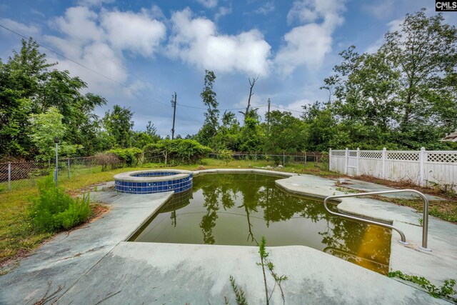 3204 Windmill Rd, Leesville, SC 29070 - view of swimming pool with a pool with connected hot tub, a patio area, and view of scattered trees