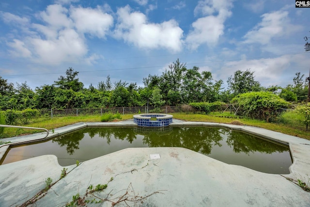3204 Windmill Rd, Leesville, SC 29070 - view of swimming pool with a pool with connected hot tub, a fenced backyard, and a patio area