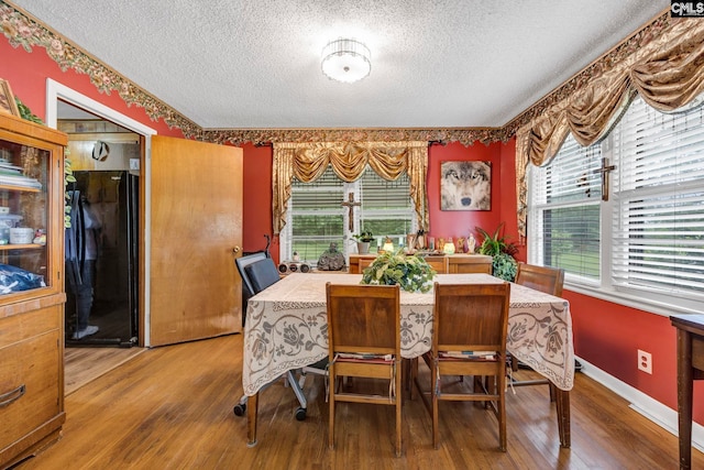 3204 Windmill Rd, Leesville, SC 29070 - dining room with a textured ceiling and wood finished floors