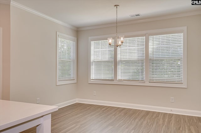 20 Belfast Ct, North Augusta, SC 29860 - unfurnished dining area with a chandelier, light wood-type flooring, and ornamental molding